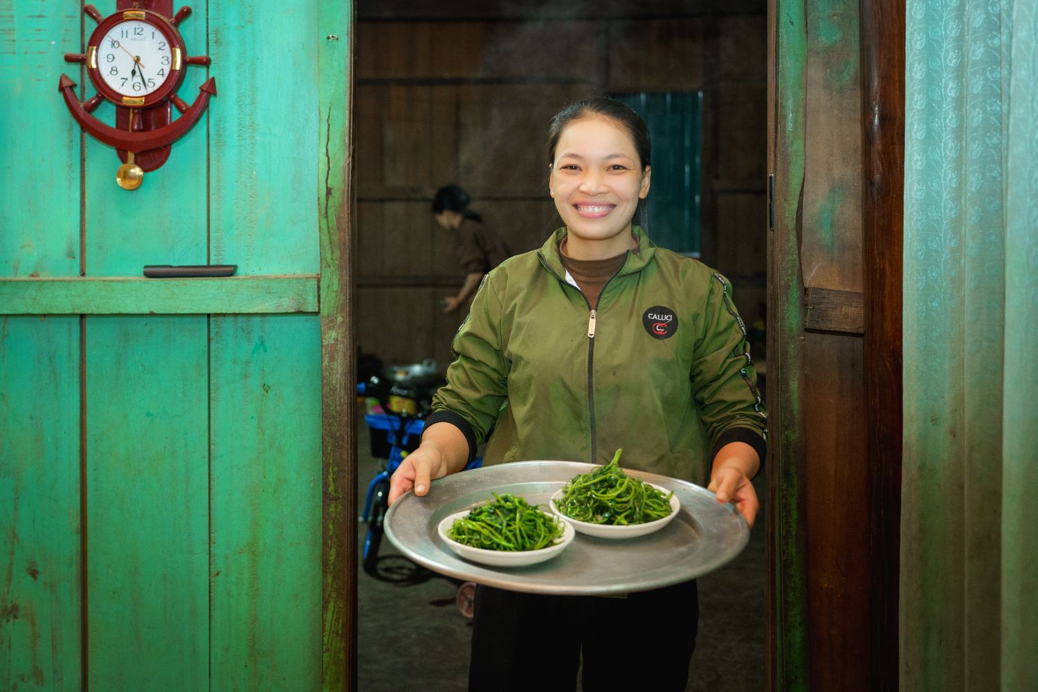 Local people in Tan Hoa prepare meals for visitors joining Oxalis Adventure cave tours.